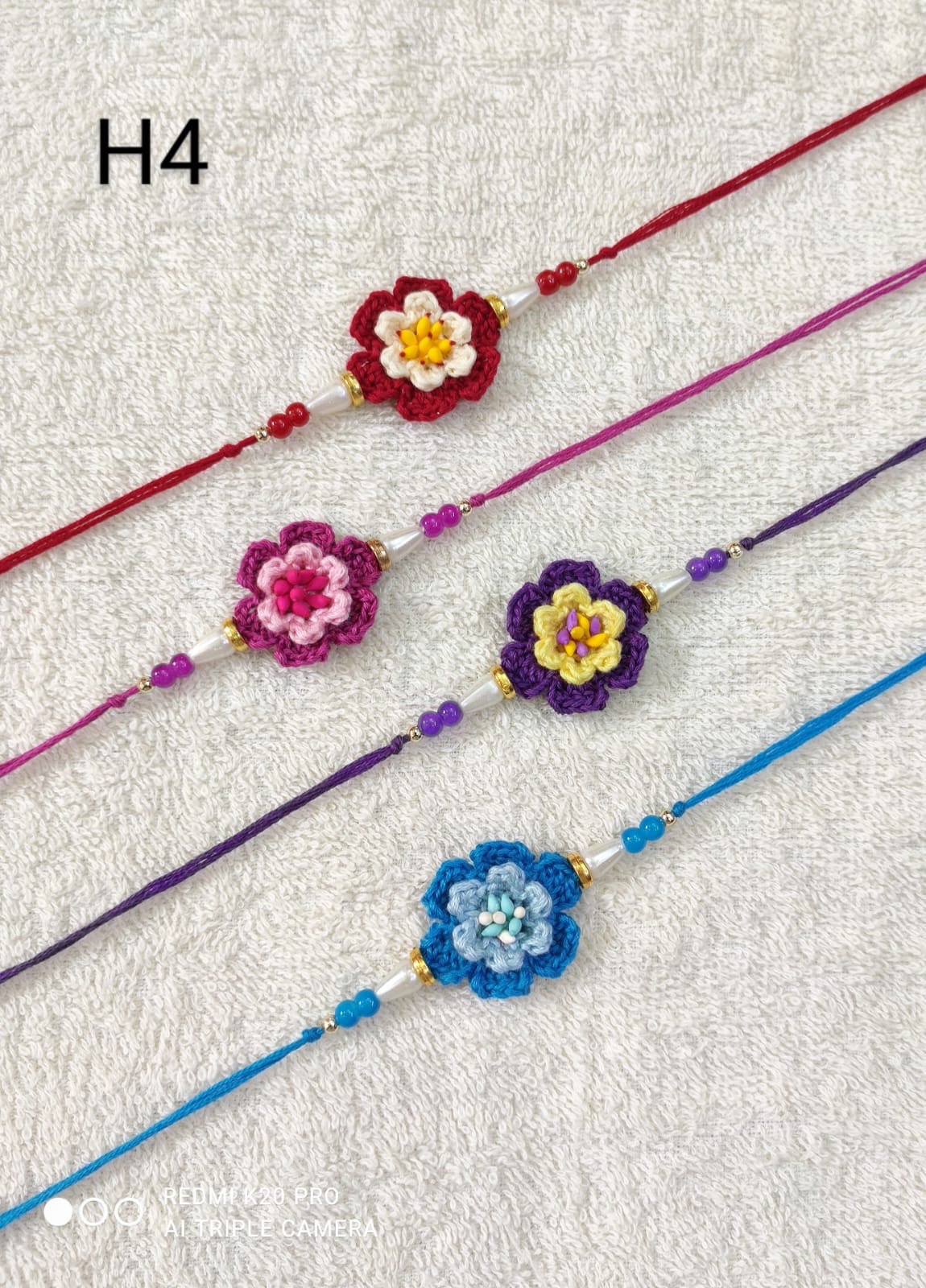 d94a05ee-538c-47b0-b968-a8056e35156d Crochet Flower Rakhi - Image 1